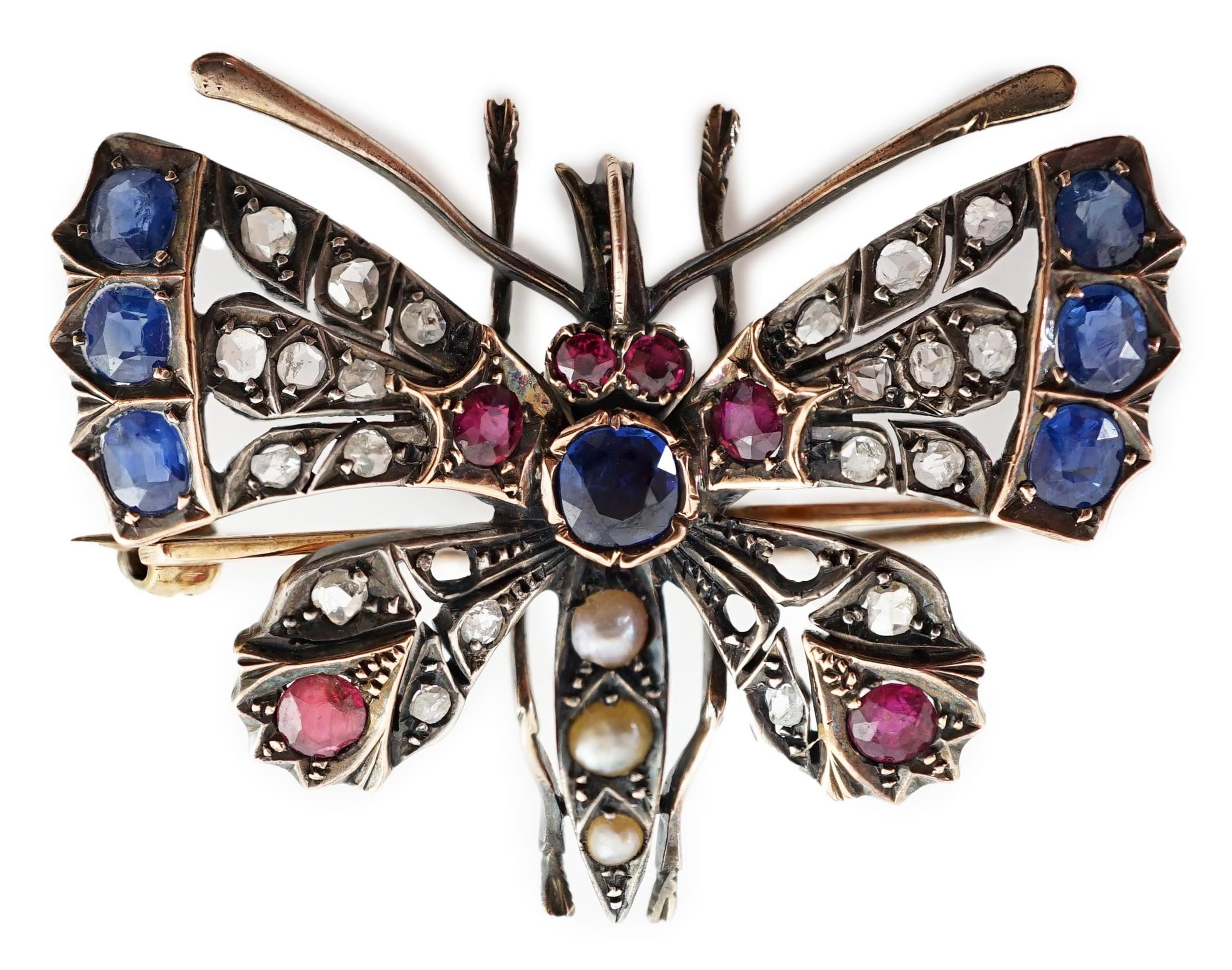 A Victorian gold, diamond, sapphire, ruby and split pearl cluster set butterfly brooch